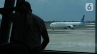 Pesawat Garuda berada di landasan pacu Terminal 3, Bandara Soekarno Hatta, Banten, Rabu (17/11/2021). Maskapai Garuda Indonesia akan menutup 97 rute penerbangannya secara bertahap hingga 2022 mendatang bersamaan dengan proses restrukturisasi yang tengah dilakukan. (Liputan6.com/Angga Yuniar)