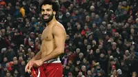 Striker Liverpool, Mohamed Salah merayakan golnya ke gawang MU. Liverpool menang 2-0, Minggu (19/1/2020) WIB (PAUL ELLIS / AFP)