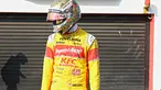 Sean Gelael menanti mobil Lamborghini yang sedang mengalami masalah teknis pada ajang Taxi Ride d Sentul, Jakarta, Selasa (2/8/2016). (Bola.com/Nicklas Hanoatubun)