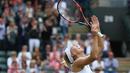 Petenis Russia, Elena Vesnina meluapkan kegembiraan usai mengalahkan petenis Slovakia, Dominika Cibulkova 6-2, 6-2 pada babak perempat final Tenis Wimbledon Championships 2016 di The All England Lawn Tennis Club, Wimbledon, (5/7/2016). (AFP/Justin Tallis)
