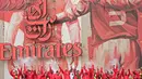 Para pemain merayakan sukses Arsenal meraih gelar Piala FA. Mereka konvoi keliling kota London untuk menyapa para fans. (AFP/Leon Neal)