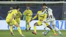 Villarreal dan Juventus harus puas bermain imbang dalam partai leg pertama babak 16 besar Liga Champions 2021/2022. (AP/Alberto Saiz)