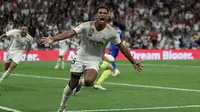 Gelandang Real Madrid Jude Bellingham&nbsp;berselebrasi setelah mencetak gol kedua timnya&nbsp;dalam LaLiga Spanyol melawan Getafe di Stadion Santiago Bernabeu pada 2 September 2023. (Thomas COEX / AFP)