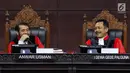 Hakim Konstitusi Anwar Usman dan I Dewa Gede Palguna tertawa saat sidang ke-5 sengketa Pilpres 2019 di Gedung MK, Jakarta, Jumat (21/6/2019). Sidang beragendakan mendengar keterangan saksi dan ahli dari pihak terkait yakni paslon nomor urut 01 Jokowi-Ma'ruf Amin. (Liputan6.com/Johan Tallo)
