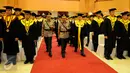 Kapolri Jenderal Badrodin Haiti menghadiri acara Dies Natalis PTIK ke-70 di Auditorium PTIK, Jakarta, Jumat (17/6). Sebagain besar dari wisudawan merupakan perwira pertama dan menengah Polri berpangkat AKP dan Kompol. (Liputan6.com/Helmi Afandi)
