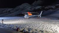 Helikopter dikerahkan dalam proses pencarian korban longsor salju di Austria pada Minggu, 25 Desember 2022. (dok. PETER RINDERER / EXPA / AFP)