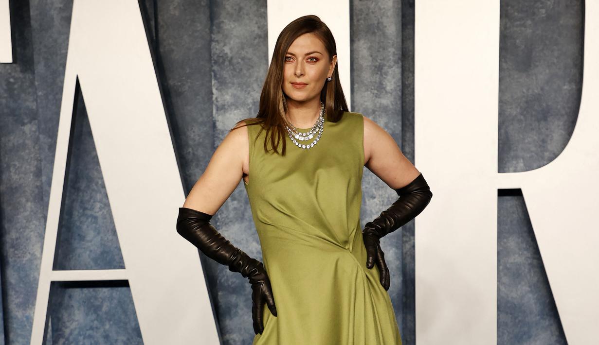 <p>Mantan Petenis Russia, Maria Sharapova berpose saat menghadiri Vanity Fair Oscar Party 2023 di Wallis Annenberg Center for the Performing Arts, Beverly Hills, California, 13 Maret 2023 WIB. (AFP/Getty Images/Amy Sussman)</p>