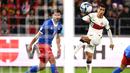 Bek Timnas Portugal, Joao Cancelo (kanan) melepaskan tendangan yang menghasilkan gol kedua ke gawang Liechtenstein pada laga lanjutan Grup J Kualifikasi Euro 2024 di Rheinpark Stadium, Vaduz, Jumat (17/11/2023) dini hari WIB. (AFP/Sebastien Bozon)