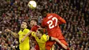 Striker Liverpool, Divock Origi, duel udara dengan pemain Dortmund pada laga Liga Europa di Stadion Anfield, Inggris, Jumat (15/4/2016) dini hari WIB. Liverpool mampu membalikan keadaaan menjadi 4-3. (AFP/Oli Scarff)