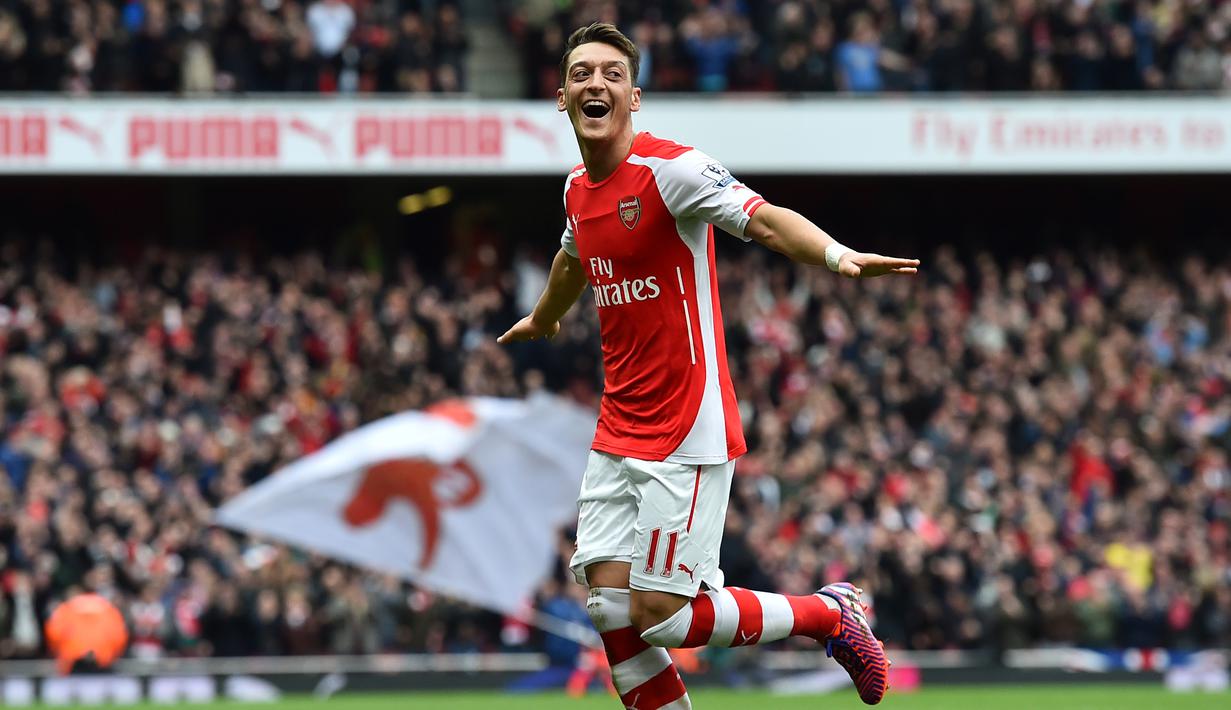 Mesut Ozil didatangkan Arsene Wenger dari Real Madrid dengan harga 729 Miliar pada September 2013. (AFP/Ben Stansall)