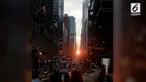 Warga Manhattan memadati jalanan utama di Borough untuk melihat keindahan fenomena Manhattanhenge yang terjadi dua kali setahun.