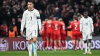 Cristiano Ronaldo gagal mencetak gol ketika Timnas Portugal bersua Denmark pada pertandingan leg pertama perempat final UEFA Nations League musim ini di Parken Stadium, Jumat (21/3/2025) dini hari WIB. Alhasil, A Selecao menelan kekalahan 0-1 dari Denmark. (AFP/Jonathan NACKSTRAND)