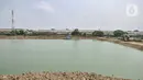 Suasana  pembangunan Waduk Belibis, Jakarta Utara, Rabu (13/10/2021).Waduk ini berfungsi sebagai kolam retensi untuk menampung aliran Kali Gubuk Genteng dan Kali Progo di tiga wilayah yakni, Pegangsaan Dua, Semper Barat dan Sukapura. (merdeka.com/Iqbal S. Nugroho)