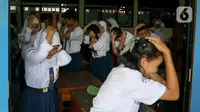 Untuk memitigasi risiko gempa bumi megathrust segmen Selat Sunda, warga Jakarta mulai dipersiapkan melalui serangkaian pelatihan simulasi bencana. (Liputan6.com/Herman Zakharia)