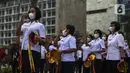 Para peserta saat mengikuti acara Christmas in Jakarta di Bundaran Hotel Indonesia, Jakarta, Selasa (21/12/2021). Pemerintah Provinsi DKI Jakarta menggelar Christmas in Jakarta dalam rangka menyambut Natal 2021. (Liputan6.com/Johan Tallo)