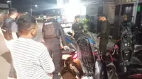 Polres Kotamobagu menertibkan warga yang pesta miras serta menggunakan knalpot bising.