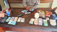 Marak uang palsu jelang pilkada di Konawe (Liputan6.com / Ahmad Akbar Fua)