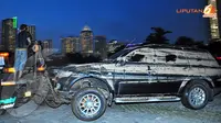 FOTO: 27 Mobil Berselimut Lumpur dari Basement 1 Plaza UOB