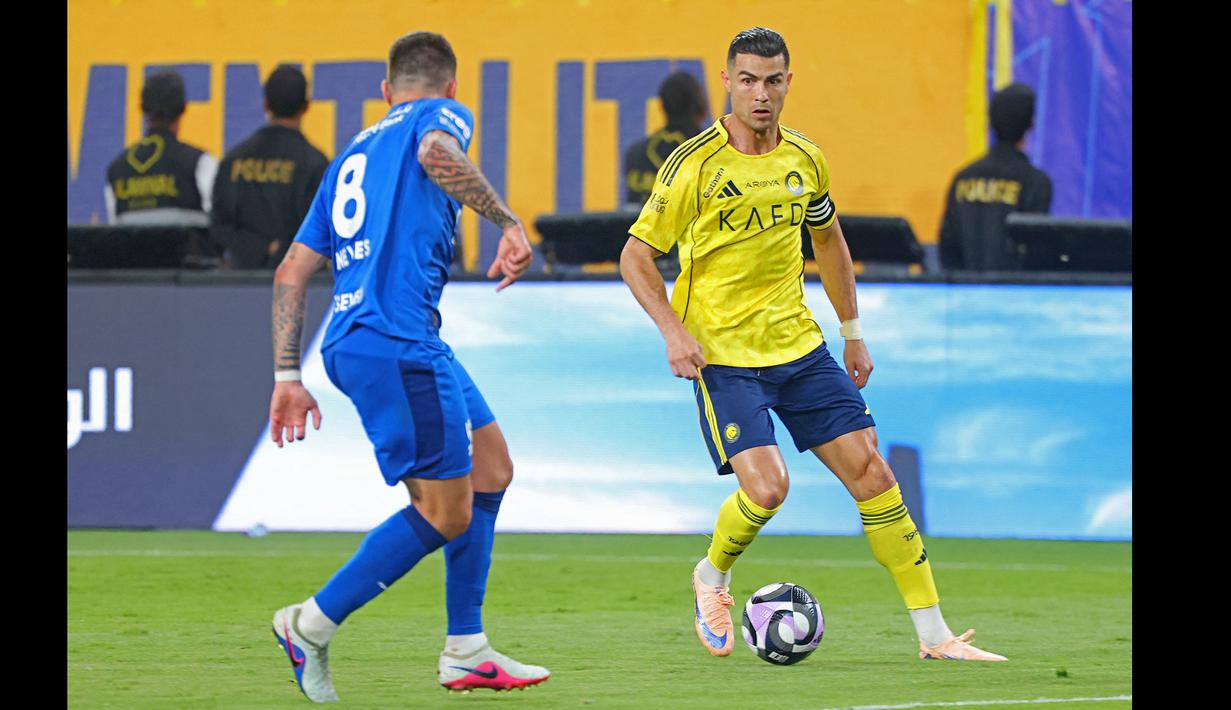 Bermain sebagai starter, Al Nassr berhasil unggul terlebih dahulu pada menit ke-37 melalui gol Mohamed Simakan. (AFP/Fayez Nureldine)