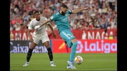 Benzema mencetak gol ketiga sekaligus membalikan keadaan untuk kemenangan Madrid di pertandingan kali ini. Aksinya selama 90 menit juga patut diacungi jempol. (AFP/Cristina Quicler)