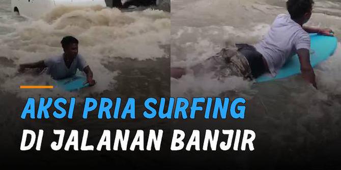 VIDEO: Manfaatkan Momen, Aksi Pria Surfing di Jalanan Banjir