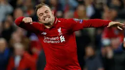 Gelandang Liverpool, Xherdan Shaqiri berselebrasi setelah akhir laga kedua semifinal Liga Champions 2018/19, melawan Barcelona di Anfield, Selasa (7/5/2019).  Liverpool sukses melaju ke final Liga Champions usai tampil sensasional menghajar Barcelona 4-0. (REUTERS/Phil Noble)