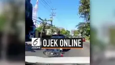 Akibat terlalu asyik menatap layar hp, seorang ojek online menabrak mobil di depannya. Beruntung korban tak terluka setelah kejadian.