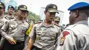 Kapolri Jenderal Pol Sutarman menyapa pasukannya yang ikut apel pengamanan pelantikan presiden dan wakil presiden di halaman Monumen Nasional, Jakarta, Jumat (17/10/2014) (Liputan6.com/Faizal Fanani)