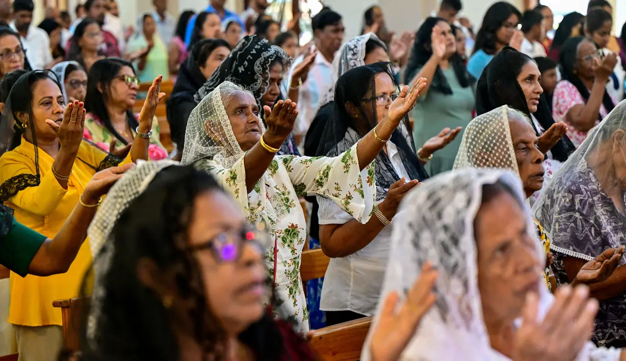 Paskah menjadi momen yang membahagiakan bagi umat Kristiani atas kebangkitan Yesus Kristus. (Ishara S. KODIKARA/AFP)