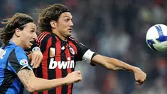 AC Milan's Paolo Maldini fights for the ball with Inter Milan's Zlatan Ibrahimovic during their Serie A match at Milan's San Siro Stadium on September 28, 2008. AFP PHOTO/Filippo MONTEFORTE