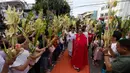 Minggu Palma merupakan sebuah peringatan yang memiliki makna yang mendalam dalam tradisi Katolik. (Ted ALJIBE/AFP)