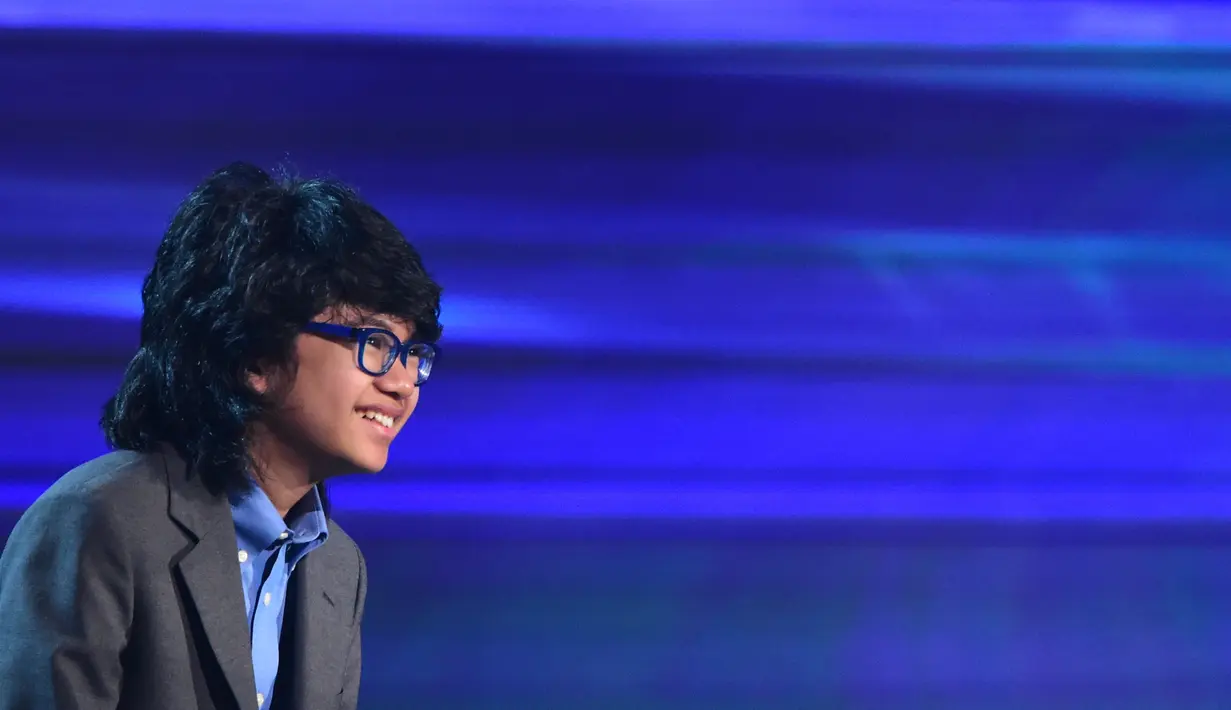 Senyum pianis muda Indonesia, Joey Alexander seusai tampil di ajang Grammy Awards 2016 di Los Angeles, Senin (15/2). Joey Alexander menjadi musisi Indonesia pertama yang tampil di panggung penghargaan musik bergengsi, Grammy. (AFP PHOTO/Robyn BECK)