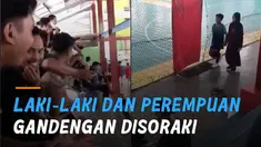 Sebuah video viral merekam momen penonton futsal menyoraki bocah yang menyoraki bocah laki-laki dan perempuan berjalan bergandengan.