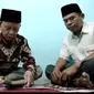 Heboh Corona covid-19, Pengantin di Kabupaten Kolaka, menikah melalui video call, Rabu (25/3/2020).(Liputan6.com/Ahmad Akbar Fua)