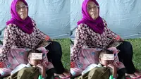 Hasan ditemukan warga dalam rangkulan sang kakek di bawah tebing usai gempa bumi melanda Ambon. Sayang, kakek dan neneknya tidak terselamatkan. (Liputan6.com/ Abdul Karim)