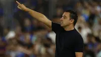 Pelatih Barcelona, Xavi Hernandez tercatat menjadi pelatih termuda keempat pada Liga Champions 2023/2024. Saat ini juru taktik yang mulai menangani Blaugrana sejak awal musim 2021/2022 menginjak usia 43 tahun. Hingga kini ia telah mencatatkan 62 kali menang, 18 imbang dan 19 kali kalah dalam 99 laga di semua ajang kompetisi. Pada matchday pertama Liga Champions 2023/2024 Barcelona menang telak 5-0 atas FC Antwerp. (AFP/Javier Soriano)