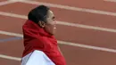 Pelari putri Indonesia Triyaningsih meraih emas nomor lari 10.000m SEA Games yang berlangsung di Stadion Nasional Singapura. Kamis (11/6). (Bola.com/Arief Bagus)