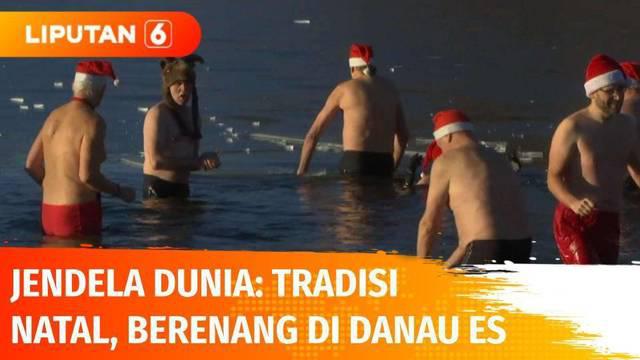 Para member Klub Renang Berliner Seals melakukan tradisi natal dengan terjun ke Danau Oranke hari Sabtu ketika suhu air mencapai 3 derajat celcius dan suhu di luar mencapai minus 5 derajat celcius.