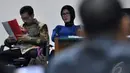 Terdakwa Walikota Palembang nonaktif Romi Herton dan istrinya Masyitoh saat menjalani sidang lanjutan di Pengadilan Tipikor, Jakarta, Kamis (8/1/2015). (Liputan6.com/Miftahul Hayat)