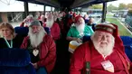 Sejumlah pria yang akan menjadi Santa Claus berada dalam bus saat perjalanan menuju sekolah Santa Claus Charles W. Howard di Midland, Michigan, Jumat (19/10). Sekolah khusus Santa Claus ini didirikan pada tahun 1937. (JEFF KOWALSKY / AFP)