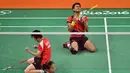 Ekspresi Tontowi Ahmad/Liliyana Natsir sesaat setelah memastikan kemenangan atas Chan Peng Soon/Goh Liu Ying dalam final ganda campuran bulutangkis Olimpiade Rio 2016, (17/8/2016). (AFP/Ben Stansall)