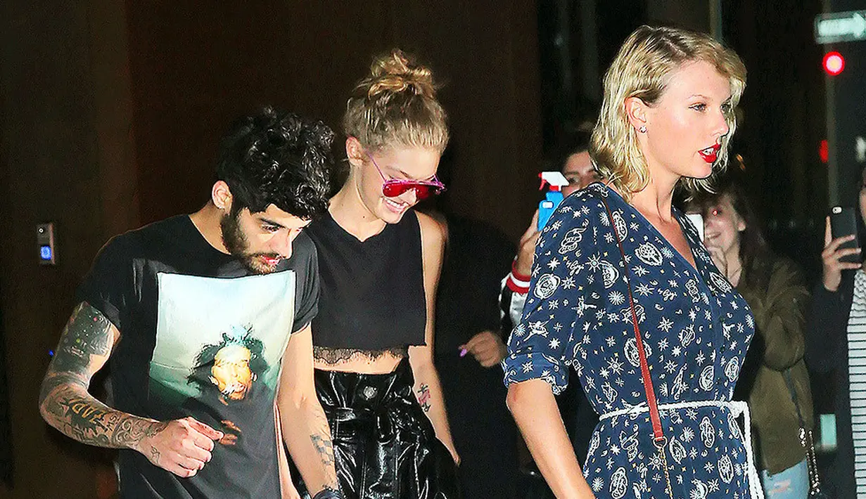 Bahkan Gigi Hadid dan Zayn Malik pernah menjadikan Taylor Swift sebagai third wheel mereka lho! (SplashNews/HollywoodLife)