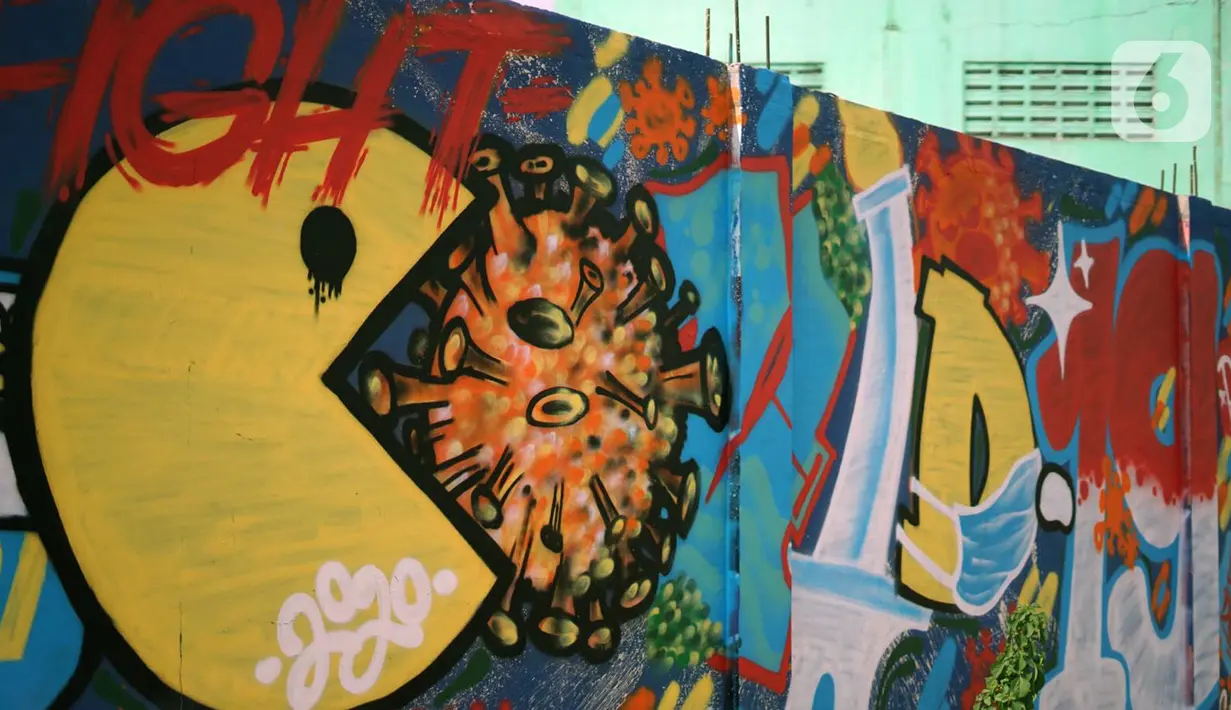 Mural bertema pandemi virus corona COVID-19 menghiasi tembok di kawasan Sunter, Jakarta, Selasa (2/6/2020). Mural tersebut dibuat sebagai wujud dukungan terhadap tenaga medis serta masyarakat agar tetap semangat menghadapi pandemi COVID-19. (Liputan6.com/Immanuel Antonius)