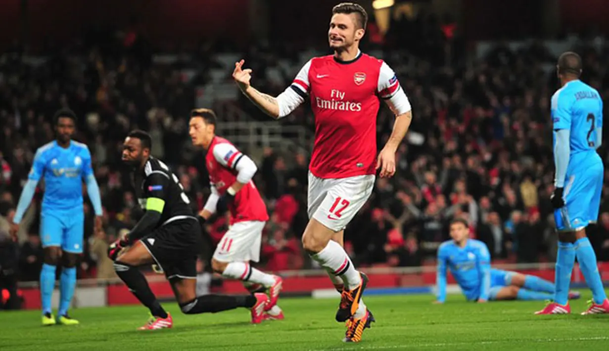 Selebrasi Pemain Arsenal Olivier Giroud Setelah Mencetak gol ke gawang Olympique Marseille pada Liga Champions Grup F antara Arsenal dan Olympique de Marseille di Stadion Emirates (27/11/2013).(AFP/Glyn Kirk)