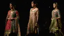 Model berjalan di runway membawakan busana rancangan desainer Dnnus Dlrar selama Pantene Hum Bridal Couture Week di Lahore, Minggu (9/12). Mereka memperagakan kreasi gaun pengantin dari sejumlah desainer ternama di Pakistan. (ARIF ALI / AFP)