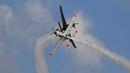 Orlik Aerobatic Team dari Angkatan Udara Polandia beraksi mengeluarkan asap saat acara Malta Internasional Airshow 2015 di Bandara Internasional Malta, Valletta, Minggu (27/9). (REUTERS/Darrin Zammit Lupi)