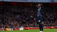 Ekspresi kecewa Marcus Rashford pada laga lanjutan Premier League yang berlangsung di Stadion Emirates, London, Minggu (10/3). Arsenal menang 2-0 atas Man United. (AFP/Ben Stansall)