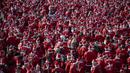 Ratusan pelari berkostum Sinterklas memadati jalanan Barcelona Spanyol dalam acara fun run 5 km pada Minggu (22/12/2024) waktu setempat. Acara tersebut menjadi salah satu bentuk menyambut hari Natal. (AFP/Josep Lago)