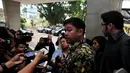 Kuasa hukum Suryadharma Ali, Andreas Nahot Silitonga, menjawab pertanyaan awak media saat dirinya tiba di Mabes Polri, Jakarta, Rabu (29/10/2014) (Liputan6.com/Johan Tallo)