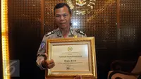 Bripka Seladi, anggota Polres Malang Kota yang menjalani pekerjaan sampingan sebagai pemulung (Liputan6.com/Johan Tallo)